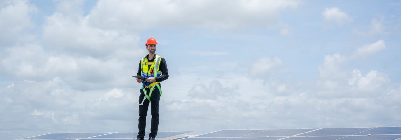 Solar power,Engineer inspect solar panels on the roof of a factory where solar panels.